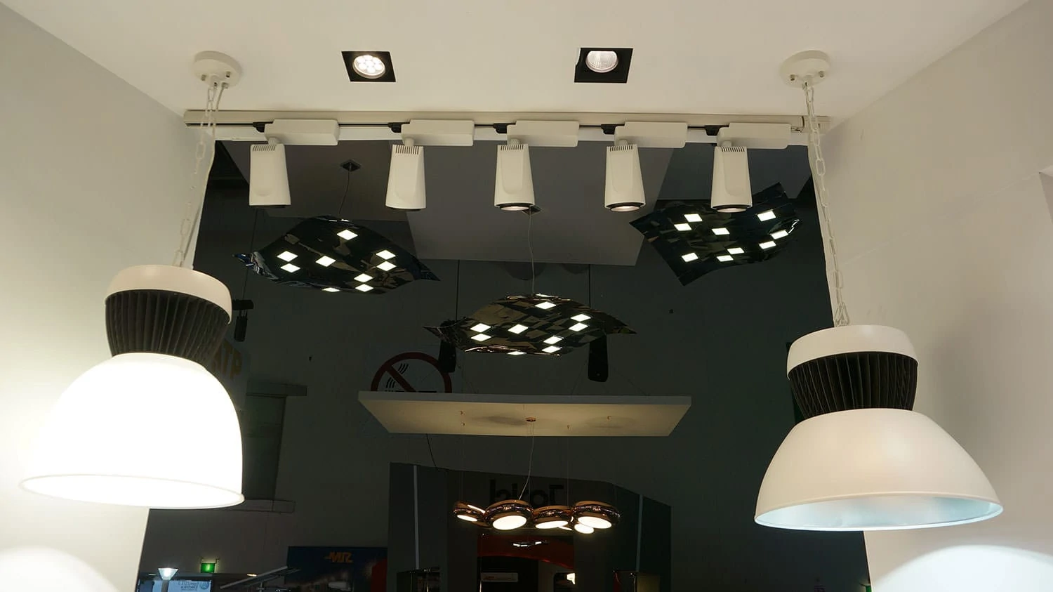 Three pendant OLED luminaires Pixelate hanging from a ceiling