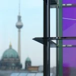 Detail of OLED luminaire and the television tower of Berlin in the background