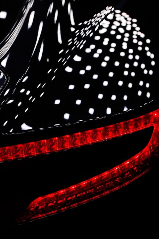 OLEDs reflecting in the car body of Aston Martin One-77