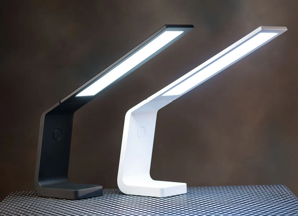 Ascend OLED desk lamp in black and white