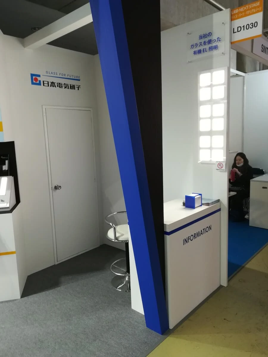 Nippon Electric Glass booth showing OLEDWorks OLED lighting panels at LED NEXT STAGE