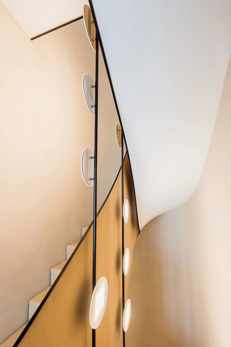 OLED light installation with round OLEDs in the stairwell of a private residential building