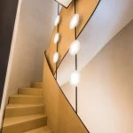Two OLED light fixtures in the stairwell of a private residential building