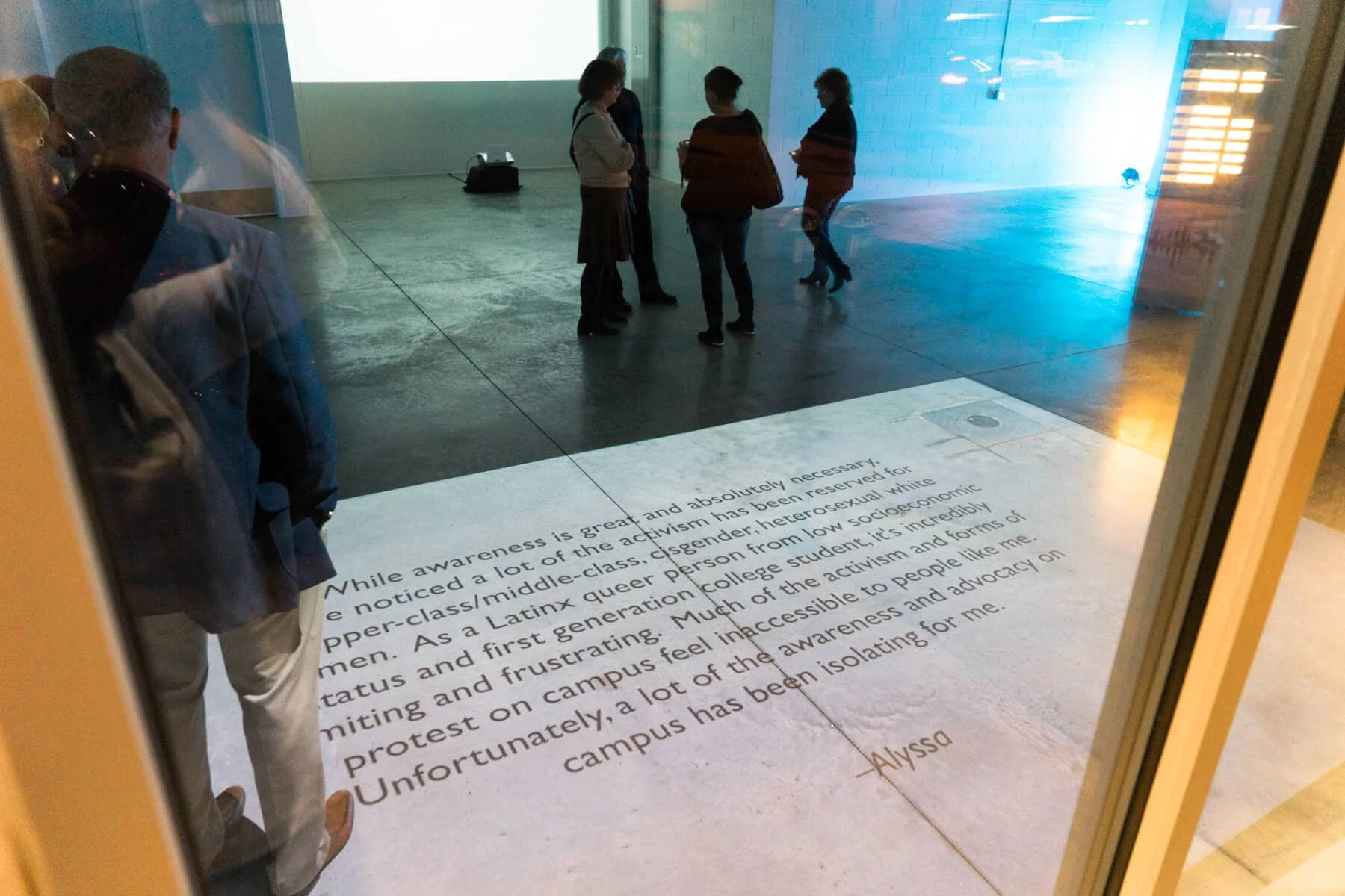 A survivor statement that is projected on the floor of the Broad Art Lab in downtown East Lansing