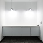 Visa Lighting’s OLED pendant luminaire Petal in the conference room nook at QCI