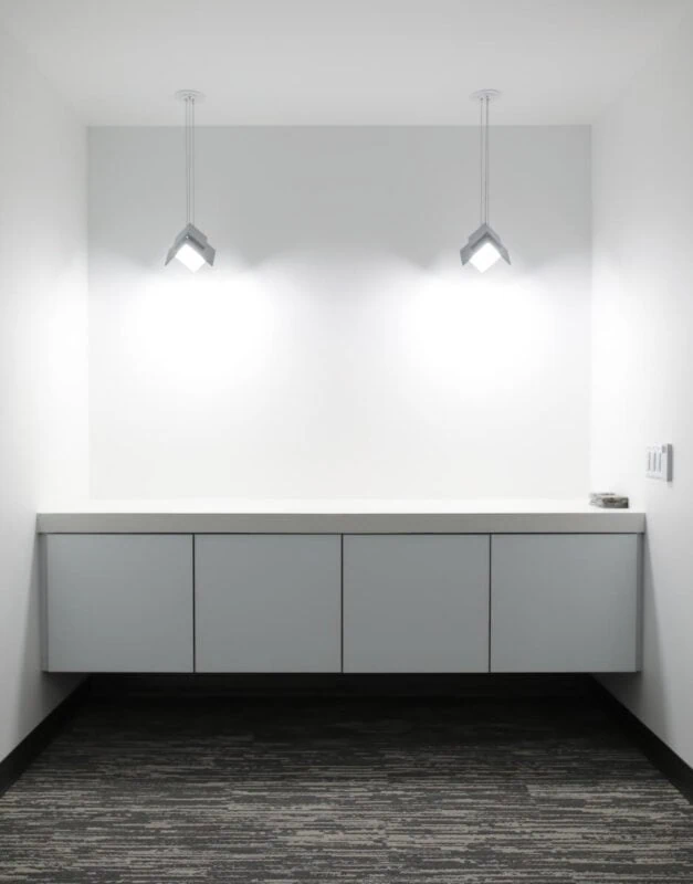 Visa Lighting’s OLED pendant luminaire Petal in the conference room nook at QCI