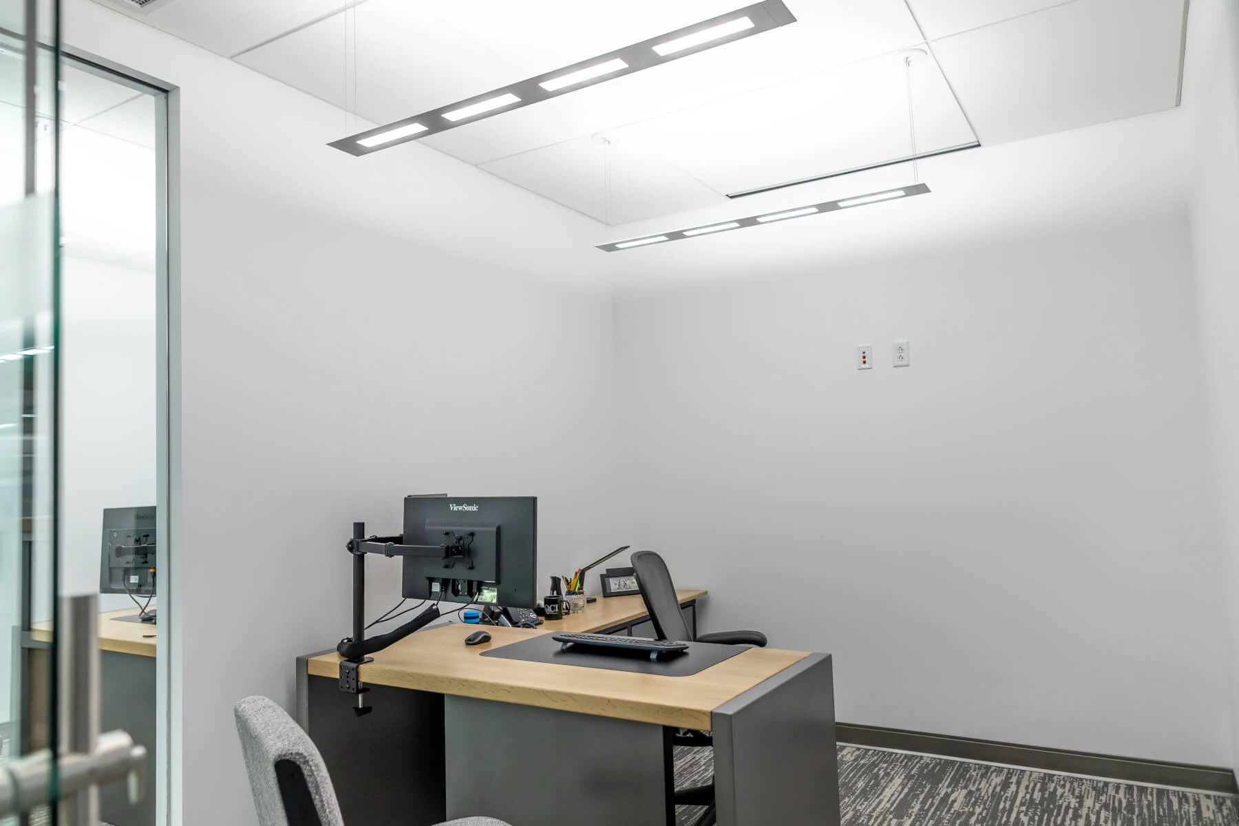 OLED pendant luminaire Olessence Slim from Acuity Brands in office of QCI