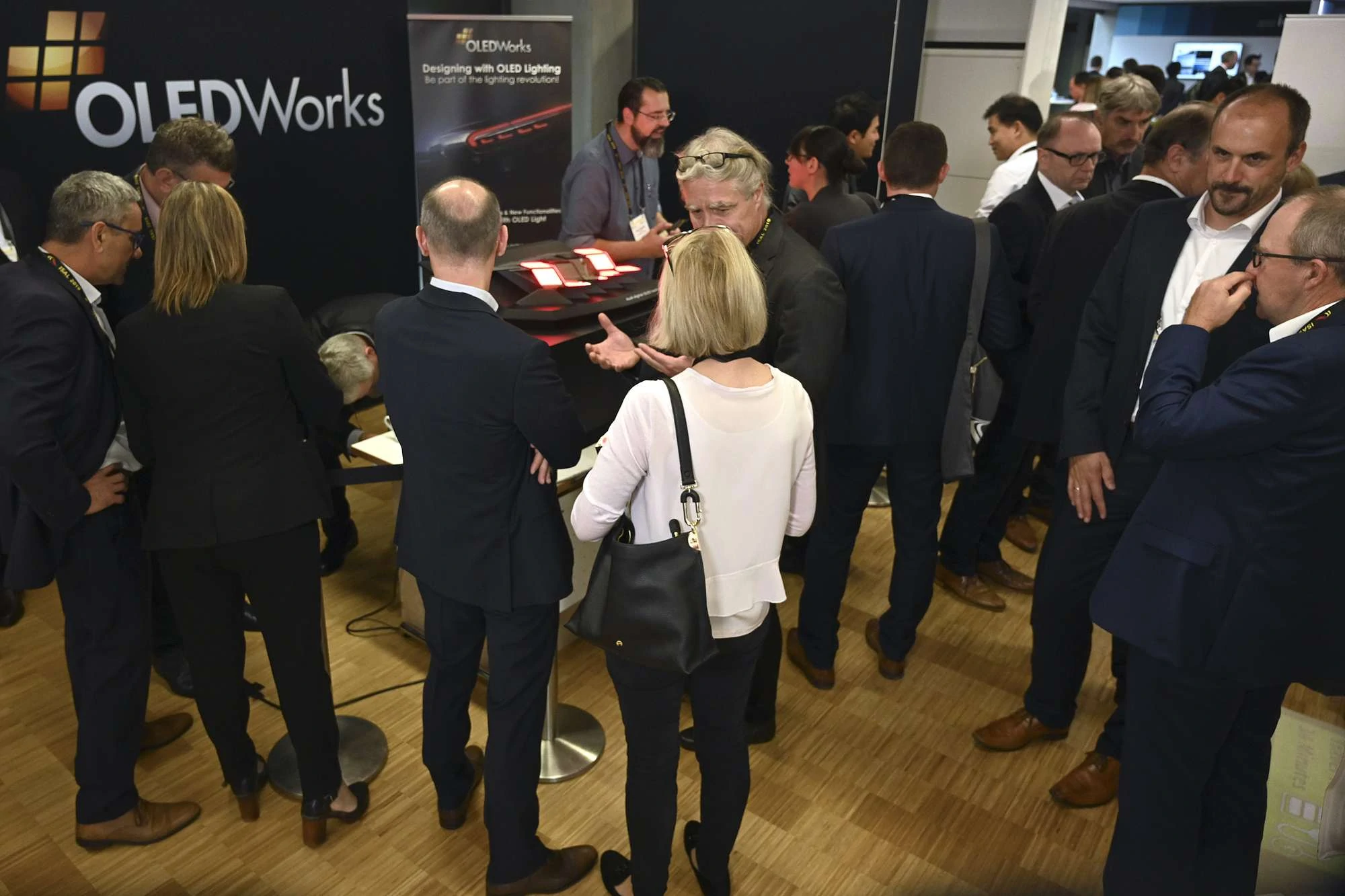 Crowded booth at ISAL 2019 | OLEDWorks