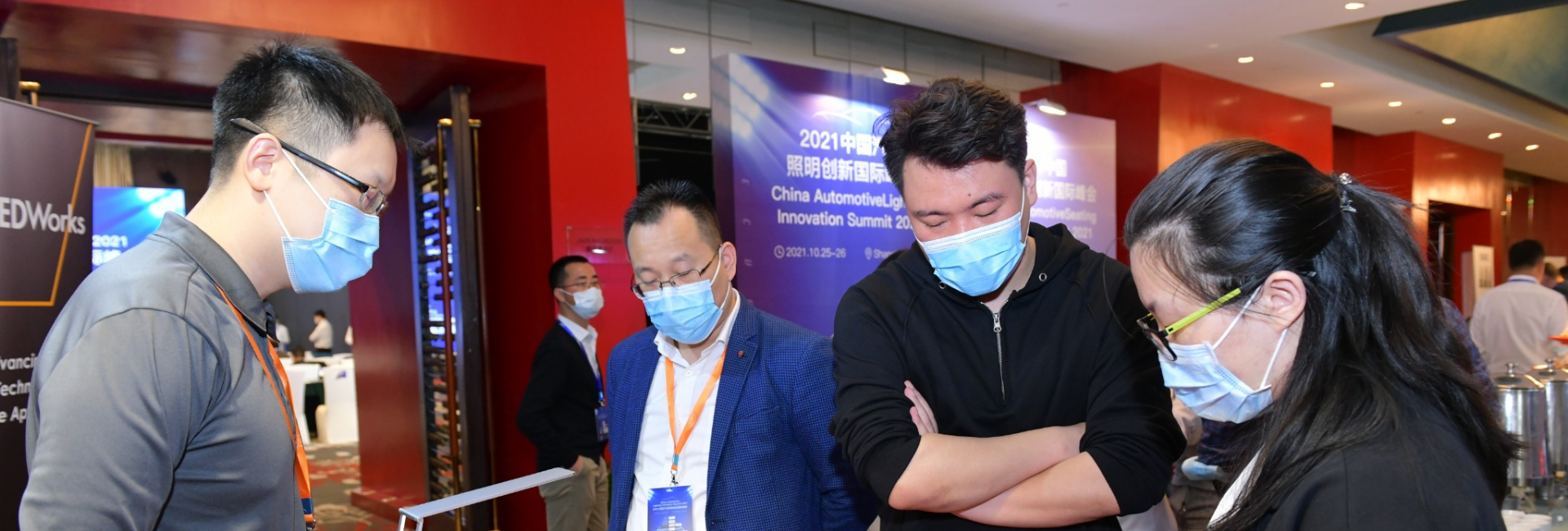 Attendees visit OLEDWorks booth at China Automotive Lighting Innovation Summit