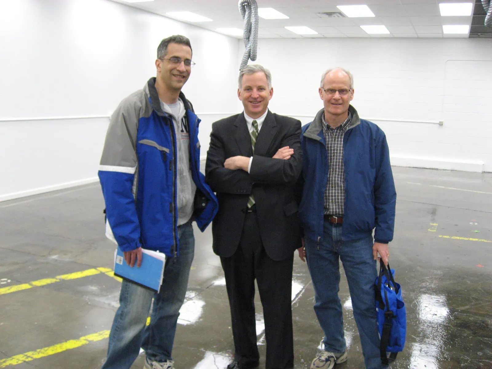 OLEDWorks founders standing in raw building space