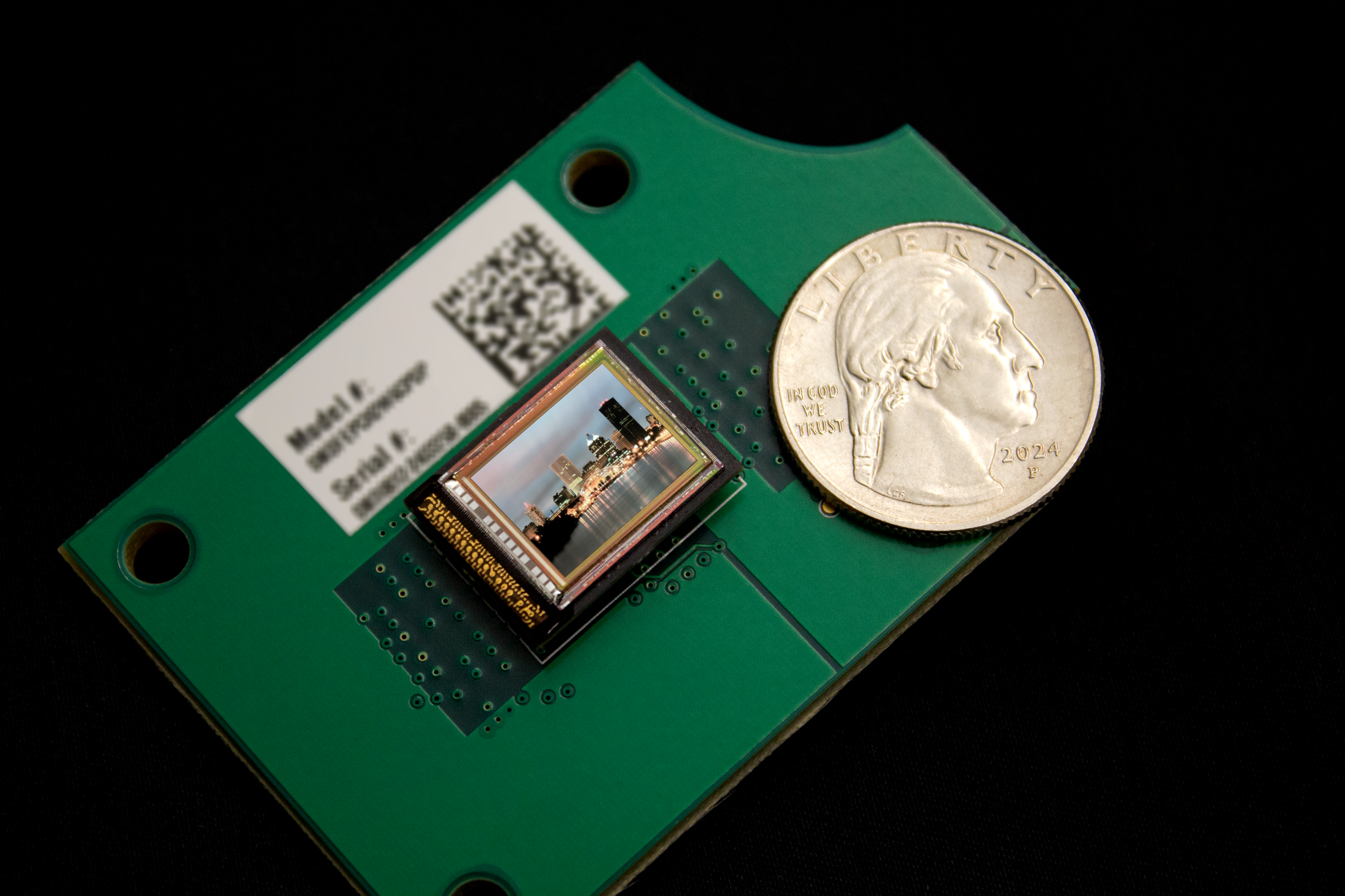 OLEDWorks microdisplay next to a United States quarter to compare sizes