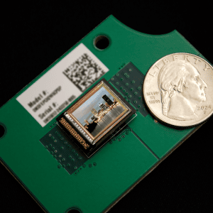 OLEDWorks Microdisplay Demonstrator Next to a Quarter - Size Comparison